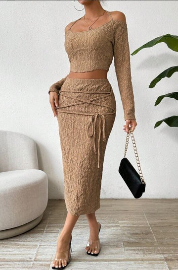 Khaki color, women's knitted suit, top with camisole and long sleeves, over painted hip skirt, paired with ribbon wrapped around the waist